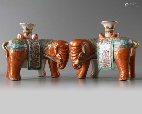 A pair of Chinese famille rose 'elephant' candle sticks