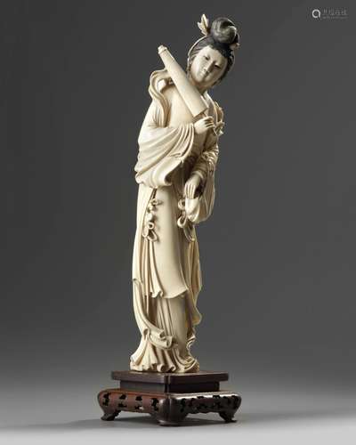 A large Chinese ivory carving of a lady holding a parasol