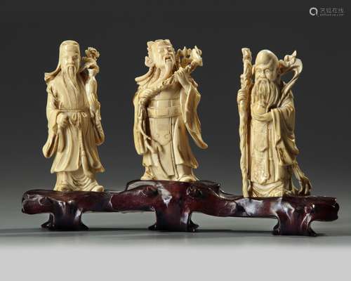 A Chinese carved ivory 'Three Star Gods' group