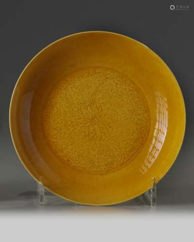 A Chinese yellow-glazed incised 'scrolling lotus' dish