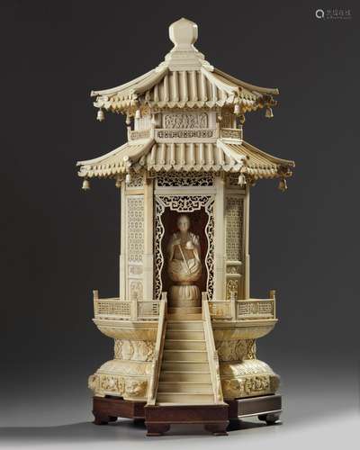 A Chinese carved ivory monk in a large ivory shrine