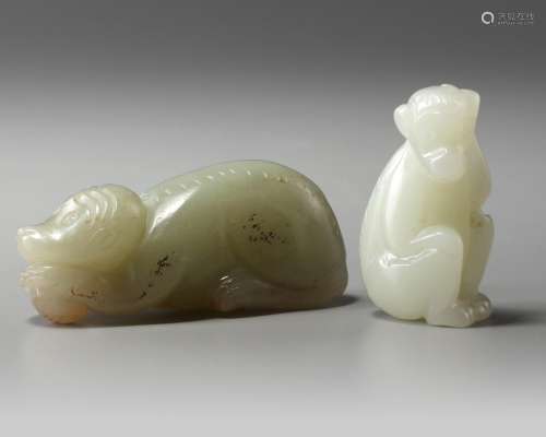 Two Chinese celadon and pale celadon jade monkeys
