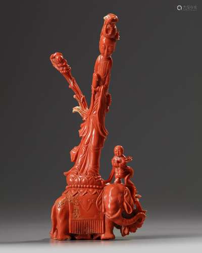 A Chinese carved coral Guanyin on an elephant