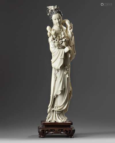 A large Chinese ivory carving of a lady