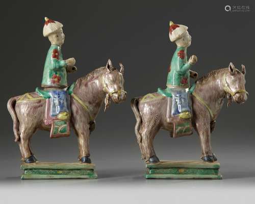 A pair of Chinese enamelled biscuit equestrians