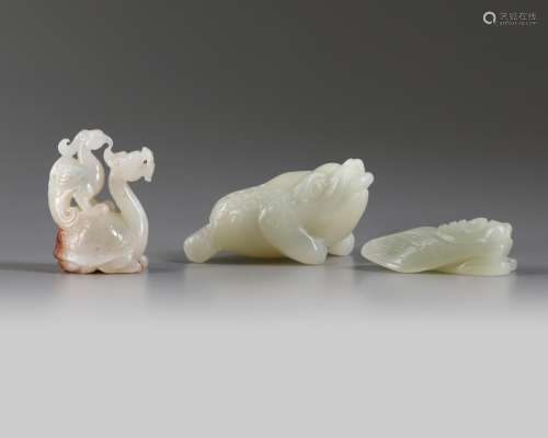 A group of Chinese white and pale celadon jade mythical beast carvings