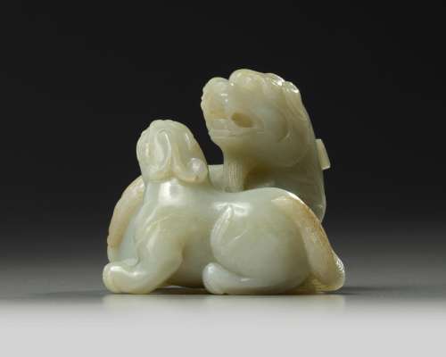 A Chinese celadon jade twin qilin carving