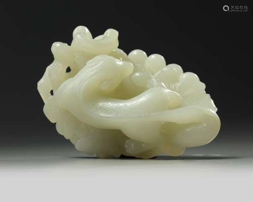A large Chinese white jade squirrel and grapes carving