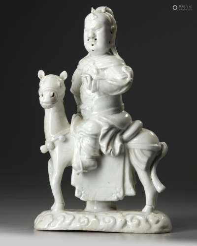 A Chinese Dehua white-glazed figure of Guandi on a horse