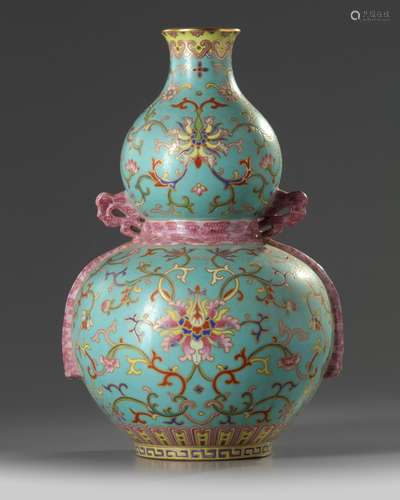 A Chinese turquoise-ground famille rose double gourd vase