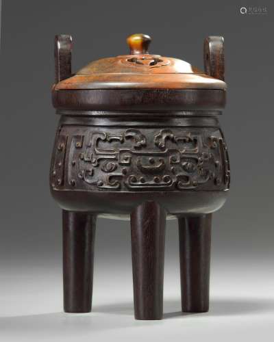 A Chinese hardwood archaistic tripod censer and cover