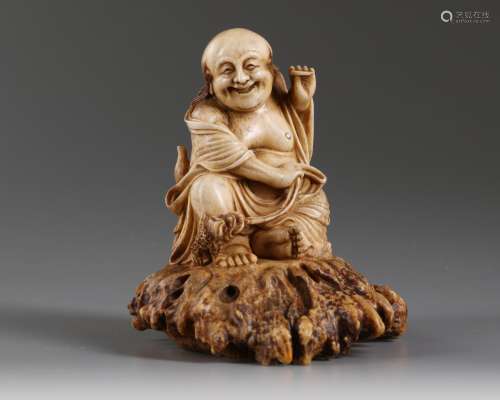 A Chinese carved bone Liu Hai