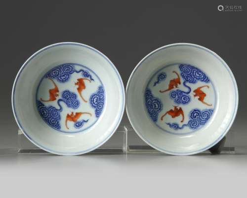 A pair of Chinese iron-red and gilt decorated blue and white bowls and cover