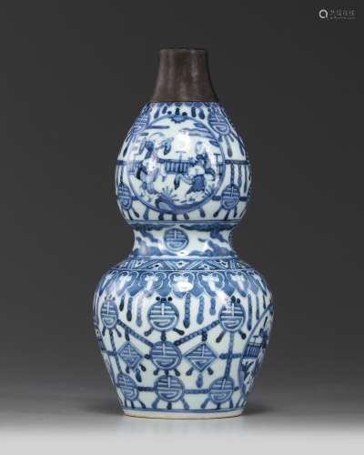 A metal-mounted Chinese blue and white 'boys' double gourd vase