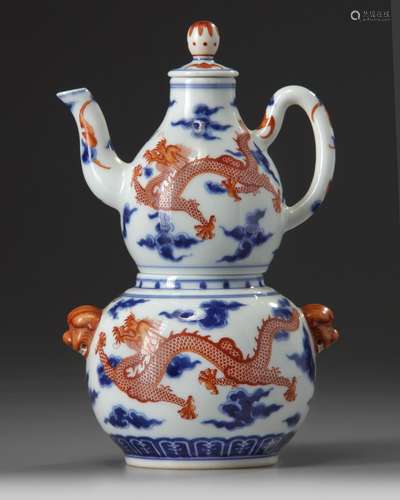 A Chinese iron-red decorated blue and white double gourd teapot, liner and cover