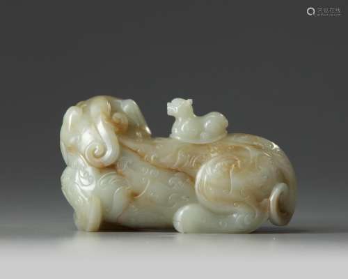 A Chinese celadon and russet jade Buddhist lion water dropper