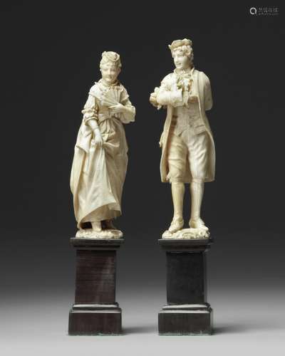 A pair of European 'Dieppe' figs on wooden stands