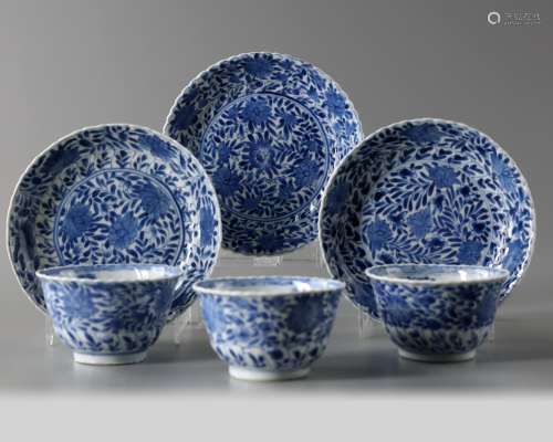 A set of Chinese blue and white scrolling lotus cups and dishes