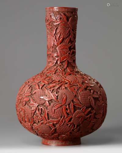 A Chinese cinnabar lacquer peaches bottle vase
