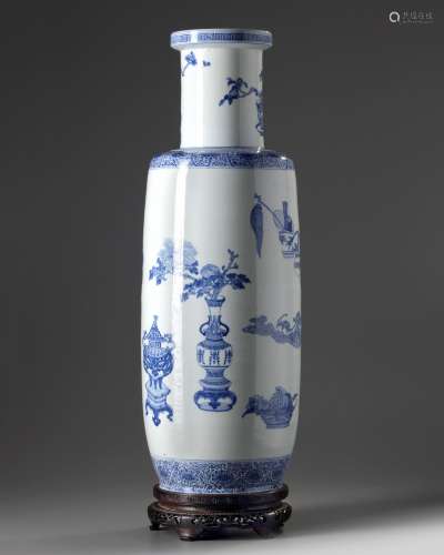 A large Chinese blue and white 'precious objects' rouleau vase