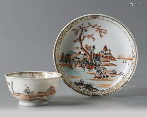 A Chinese enamelled and gilt cup and saucer