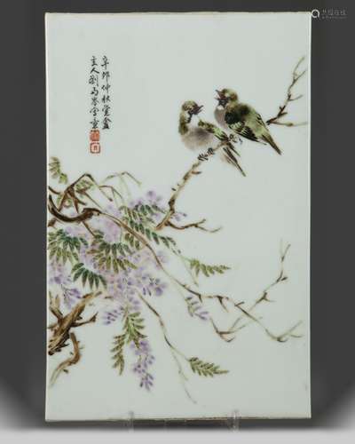 A Chinese enamelled birds and wisteria porcelain plaque