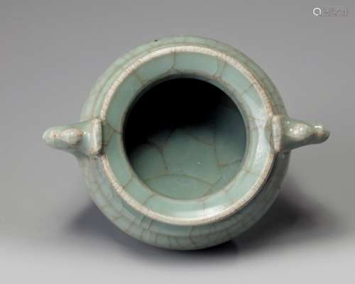 A Chinese celadon crackle-glazed tripod censer