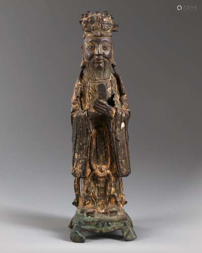 A Chinese gilt-lacquered bronze figure of a Guardian