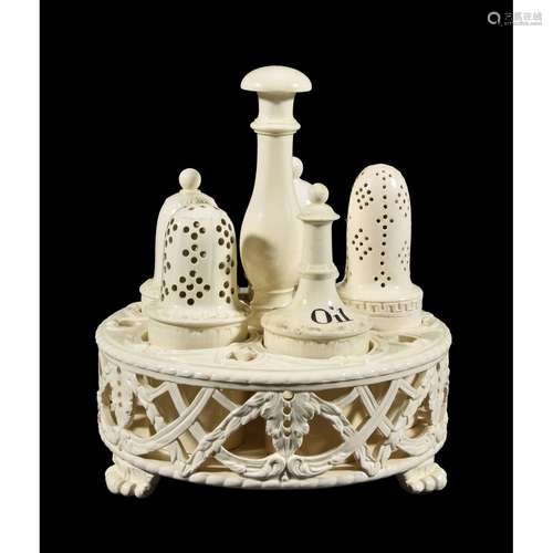 A Wedgwood ‘Queen’s Ware’ cruet stand and associated bottles