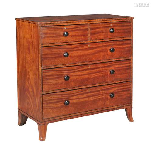 A George III satinwood and amboyna chest of drawers,