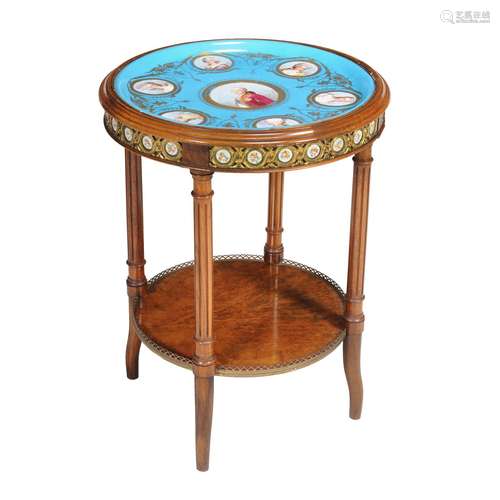 A French walnut, gilt metal mounted and Sevres-style porcelain inset centre table