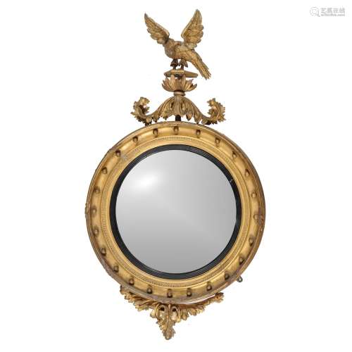 A George III giltwood and composition circular convex wall mirror