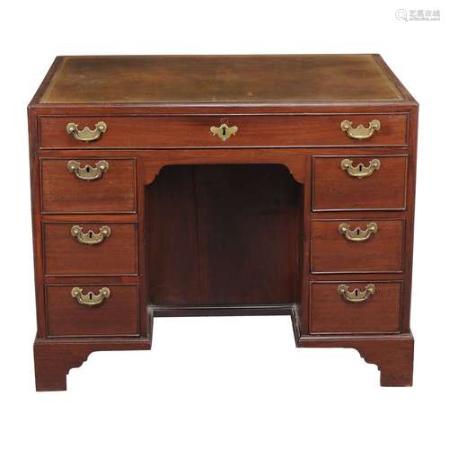 A George III mahogany double sided knee hole desk