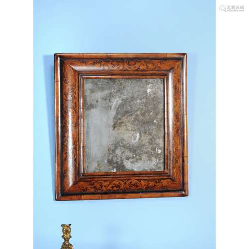 A William & Mary walnut and arabesque marquetry cushion framed wall mirror