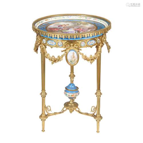 A French Sevres style porcelain and gilt metal tripartite table