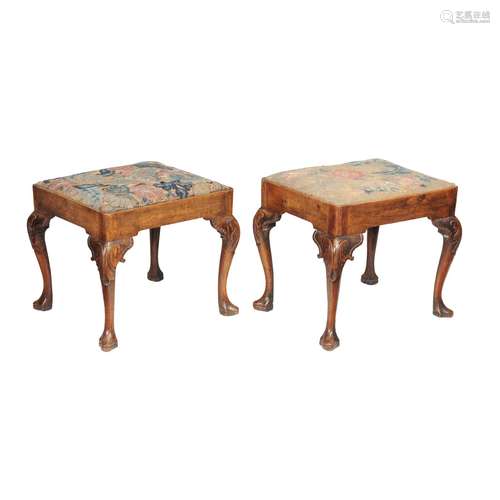 A companion pair of George II walnut and tapestry upholstered stools