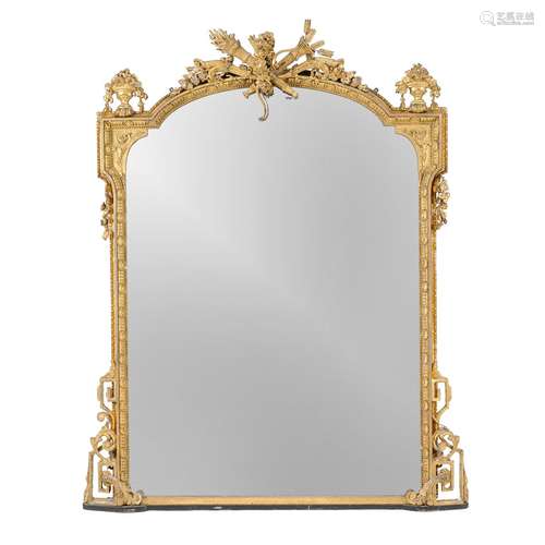 A carved giltwood and composition wall mirror