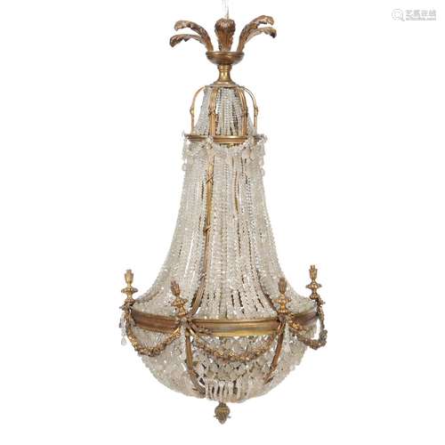 A gilt metal and cut glass bead swagged six light chandelier in Regency taste