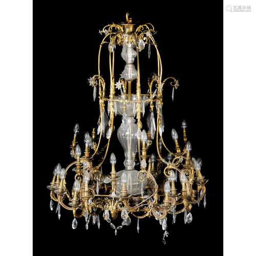 A substantial gilt bronze and glass hung thirty-five light chandelier