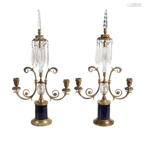 A pair of Regency brass and glass twin light lustre candelabra