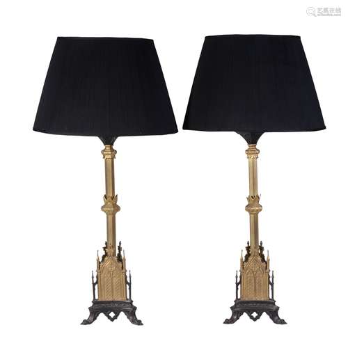 A pair of gilt and patinated metal table lamps in Regency Gothic revival taste