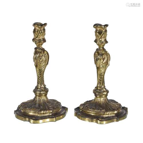 A pair of Louis XV ormolu candlesticks