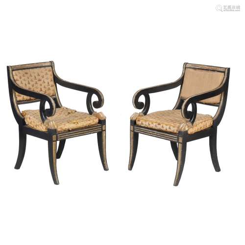 A pair of George III ebonised and parcel gilt armchairs in the manner of Henry Holland