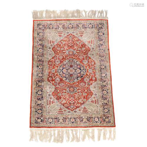 A Persian silk rug
