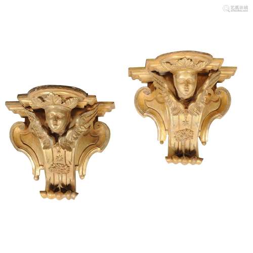 A pair of carved giltwood wall brackets