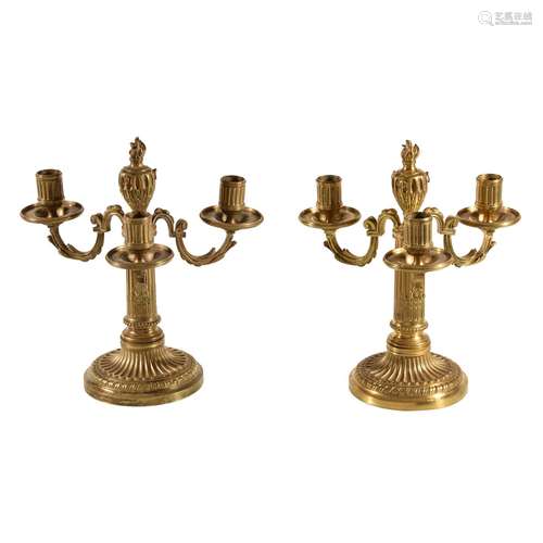 A pair of fine Louis XVI ormolu three light candelabra