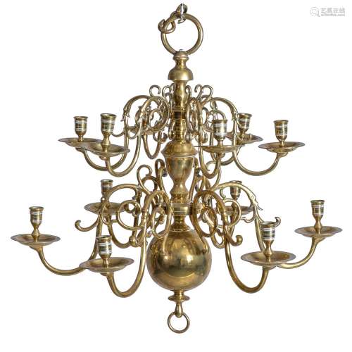 An English or Dutch brass twelve light chandelier