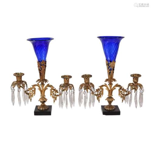 A pair of Regency gilt bronze and glass lustre hung twin light candelabra