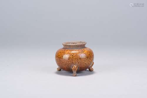 A rare marbled tripod censer