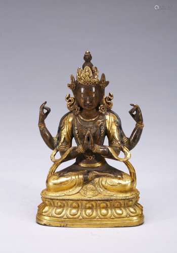 A gilt-bronze figure of four-armed bodhisattva